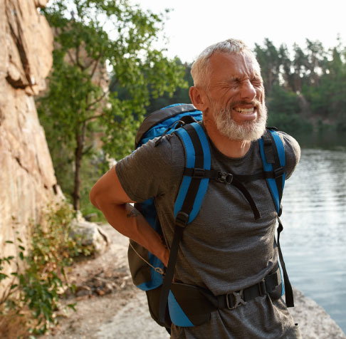 Man in pain hiking